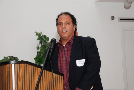 Mohamed ElJahmi accepts the award on behalf of hs son Tarek